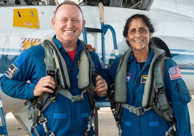 A man and a woman, in flight suits.
