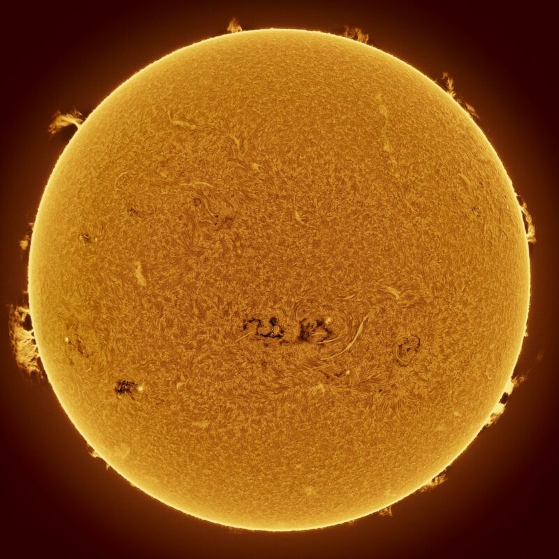 The sun, seen as a large yellow sphere with a mottled surface.