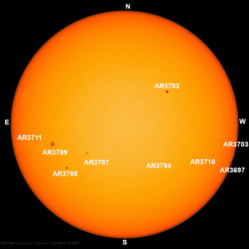 The sun, seen as a large yellow sphere with dark spots, each labeled.