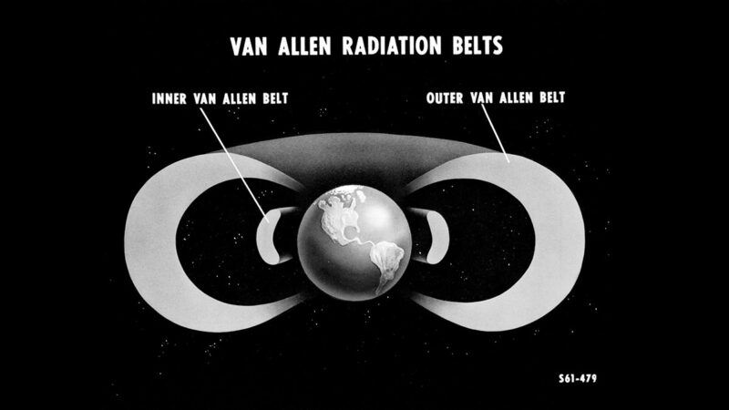 Black and white image of Earth, surrounded by 2 rings, also in black and white.