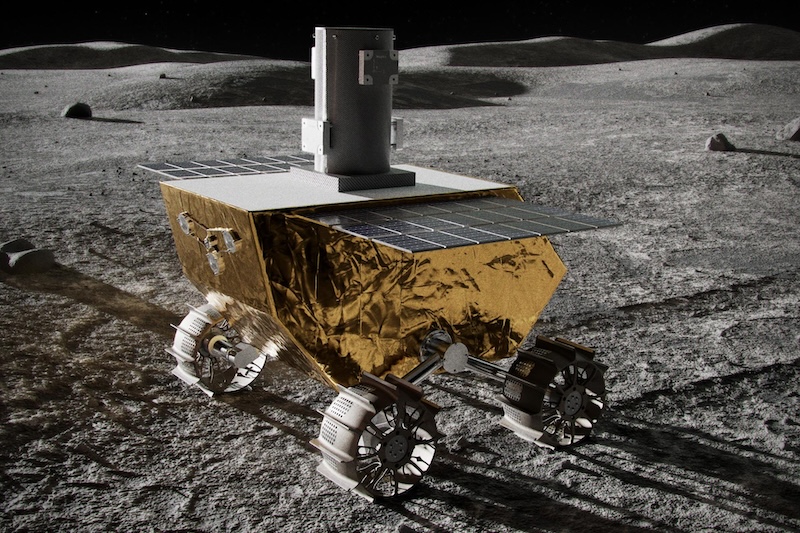 Mechanical rover covered in gold foil, with 4 wheels on gray terrain with low hills in distance.