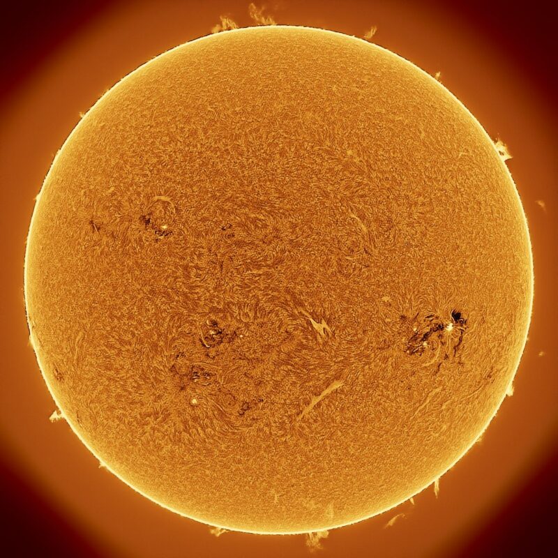 The sun, seen as a large yellow sphere with a mottled surface.