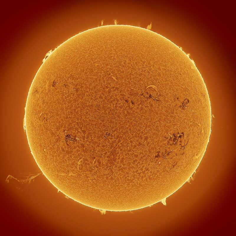 Next solar cycle: The sun, seen as a large yellow sphere with a mottled surface and little jets on the edges.