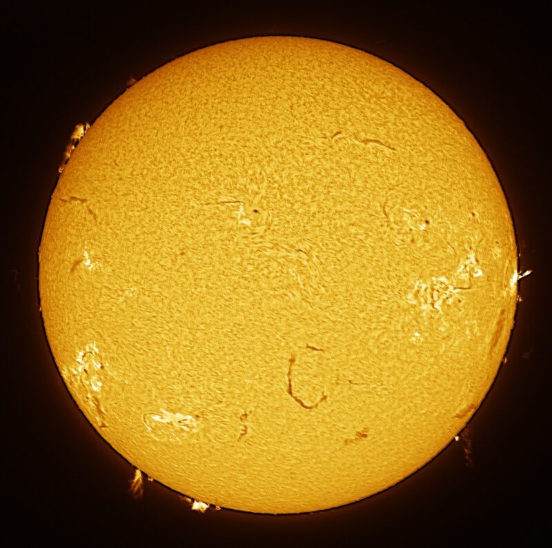 The sun, seen as a large yellow sphere with a mottled surface.