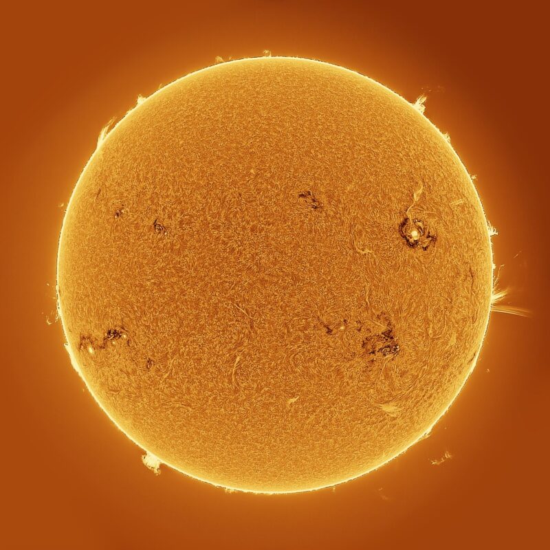 The sun, seen as a large yellow sphere with a mottled surface.