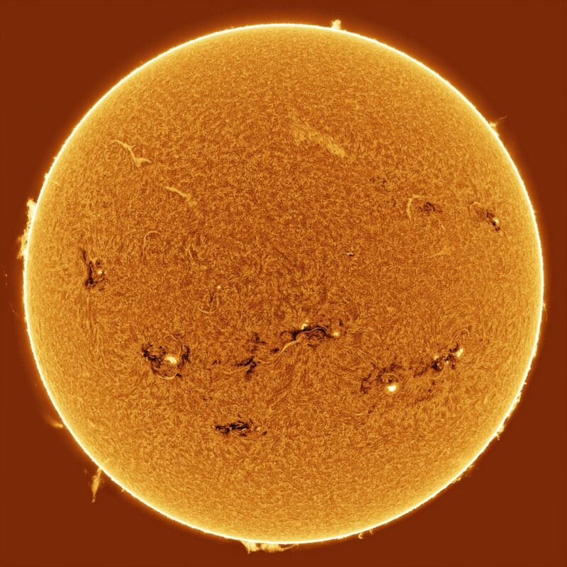 The sun, seen as a large yellow sphere with a mottled surface.