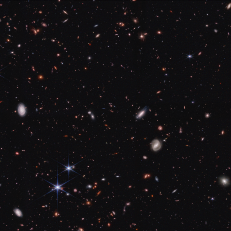 Early galaxies: Black space with very many small oval smudges in it for galaxies.