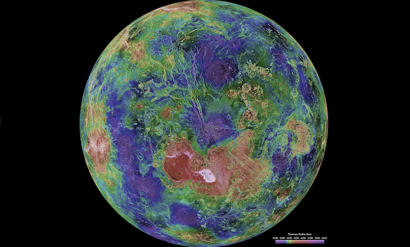 Continents on Venus: Planet with textured landscape of many multicolored regions, hanging in black space.