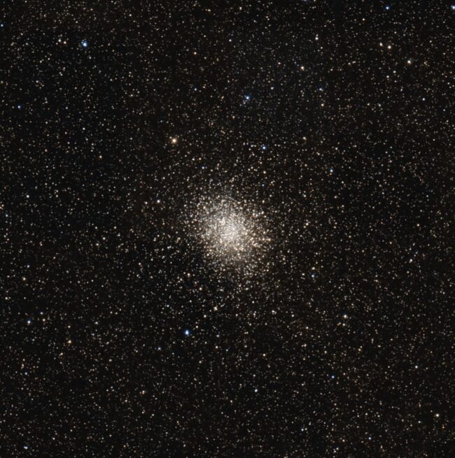 A large, spherical cluster containing thousands of bright stars.