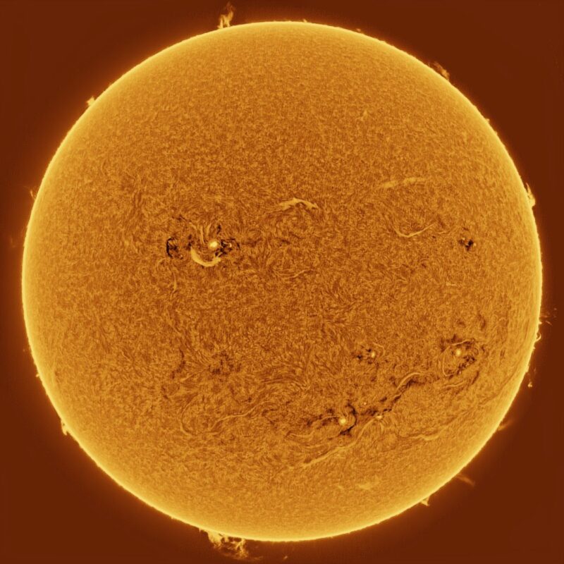 The sun, seen as a large yellow sphere with a mottled surface.