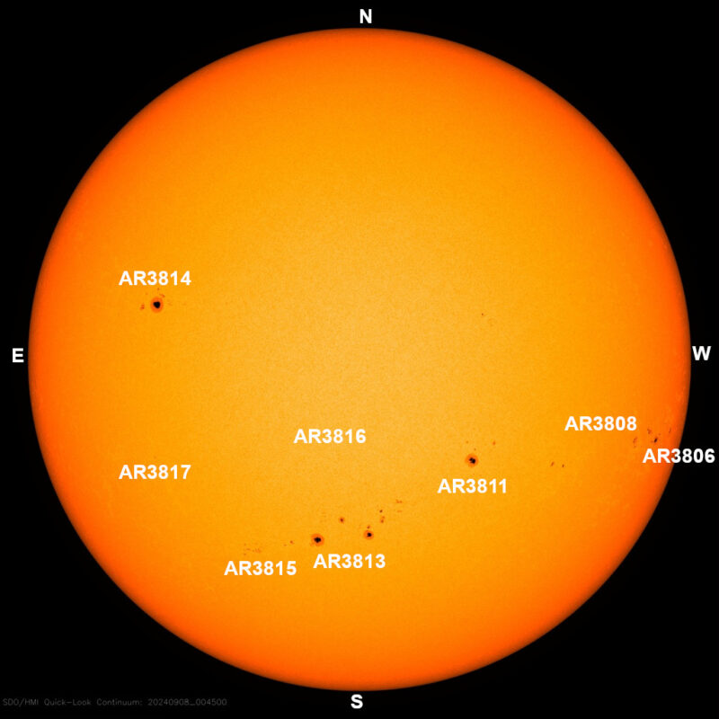 The sun, seen as a large yellow sphere with dark spots, each labeled.