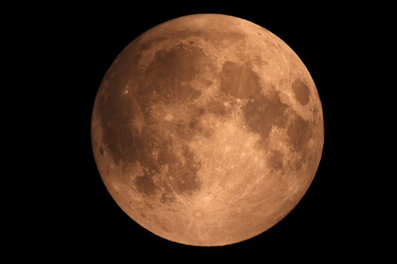 An orangish full moon.