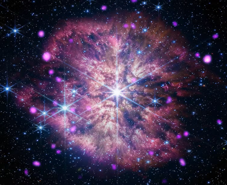 Cosmology: A bright star at center surrounded by pinkish clouds and other colorful stars.