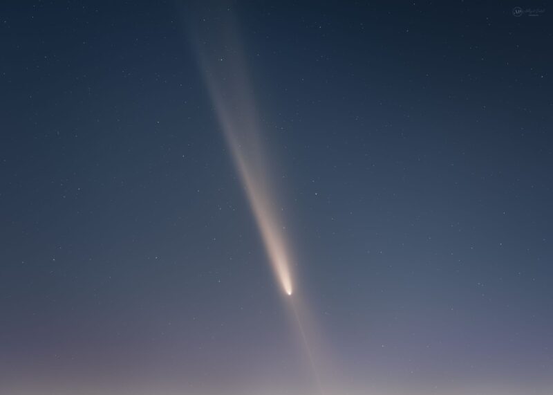 Comet with a fanned tail and a streak leading down from the head.