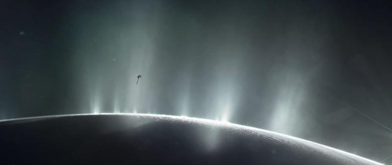 Complex organics on Enceladus: Shadowed edge of planet-like body with several bright plumes erupting from the surface. Small spacecraft close to the plumes.