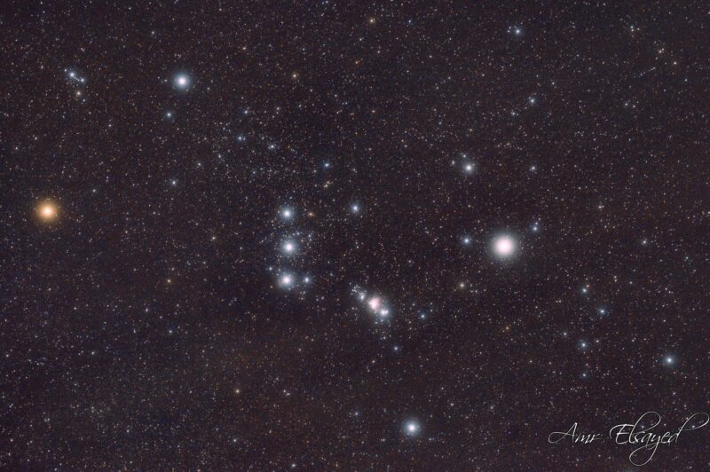 Bright stars with a prominent row of 3, plus a fuzzy patch nearby.