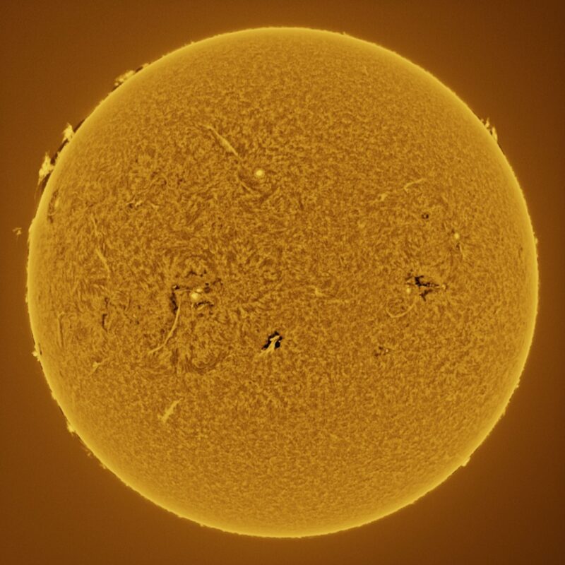 The sun, seen as a large yellow sphere with a mottled surface.