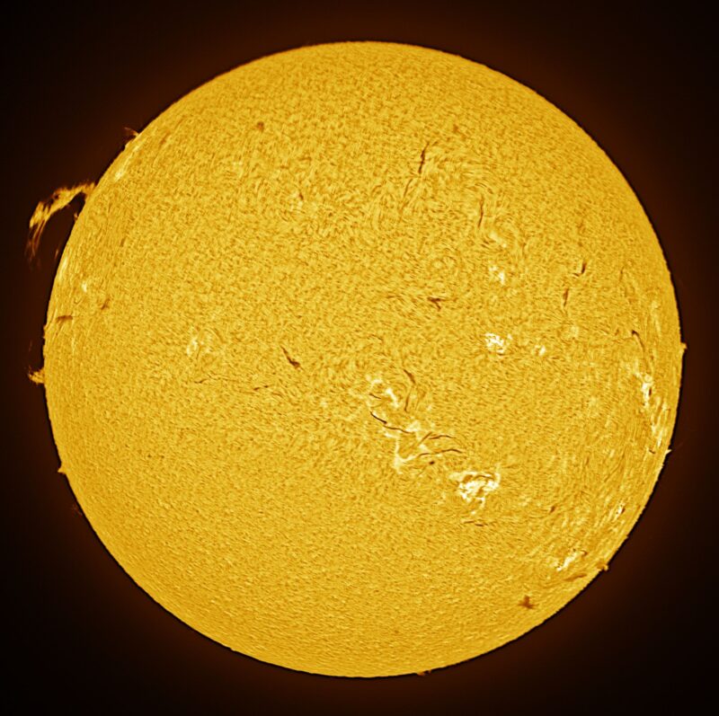The sun, seen as a large yellow sphere with a mottled surface.