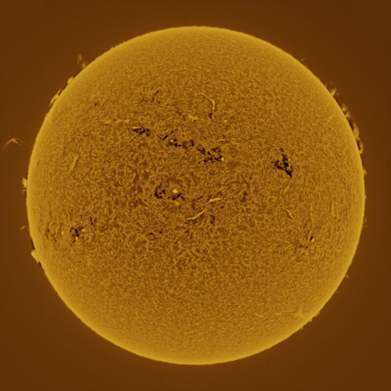 The sun, seen as a large yellow sphere with a mottled surface.