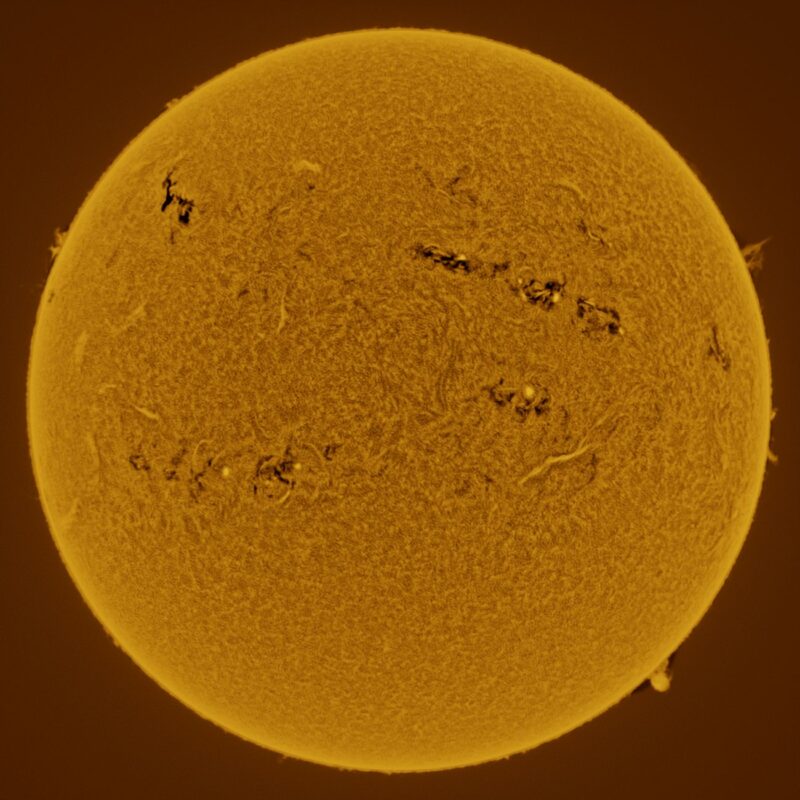 The sun, seen as a large yellow sphere with a mottled surface.