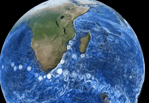 Zooming in toward southern Africa with chains of many white swirls in the ocean.