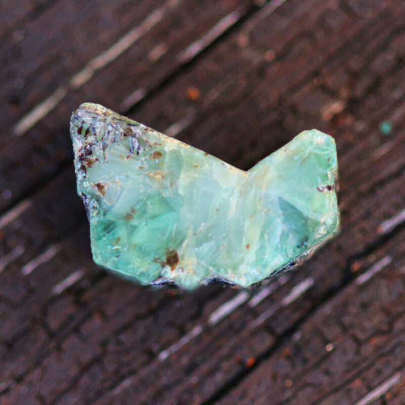 Light, green rock with a letter "v" shape.