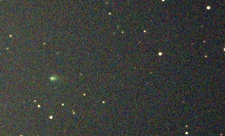 Small fuzzy ball of light at left on a starfield.