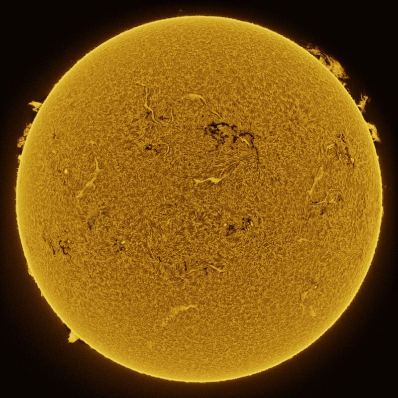 The sun, seen as a large yellow sphere with a mottled surface.