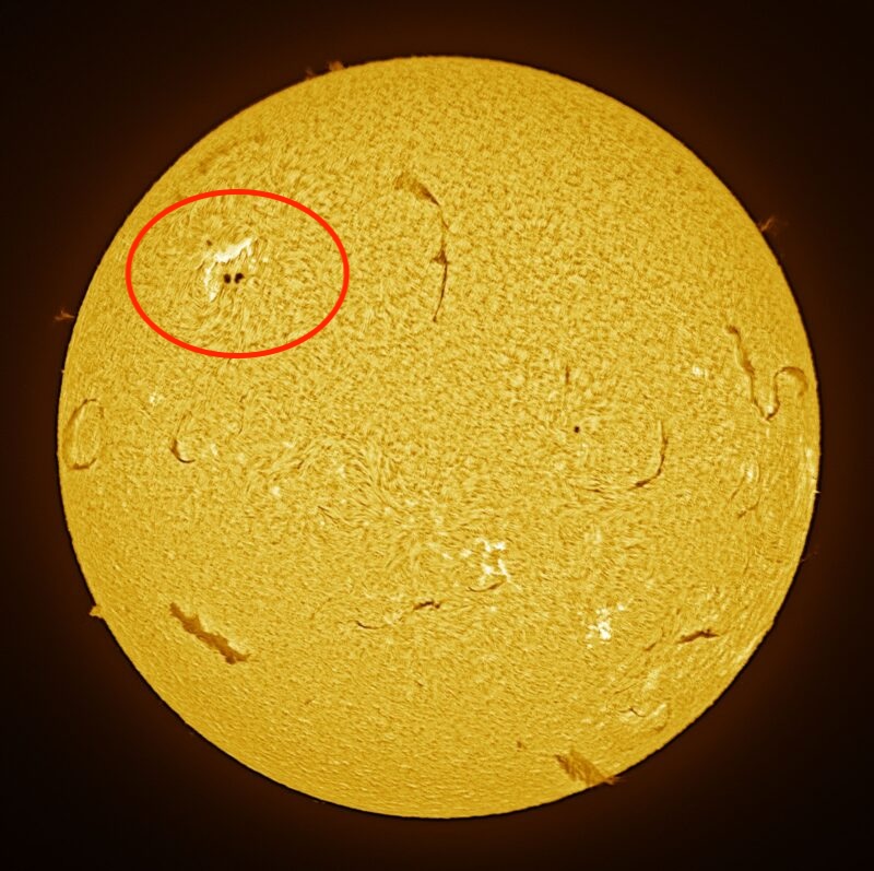 The sun, seen as a large yellow sphere with a mottled surface.