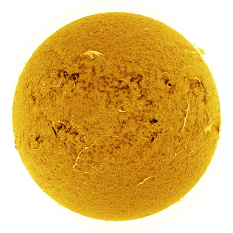 The sun, seen as a large yellow sphere with a mottled surface.