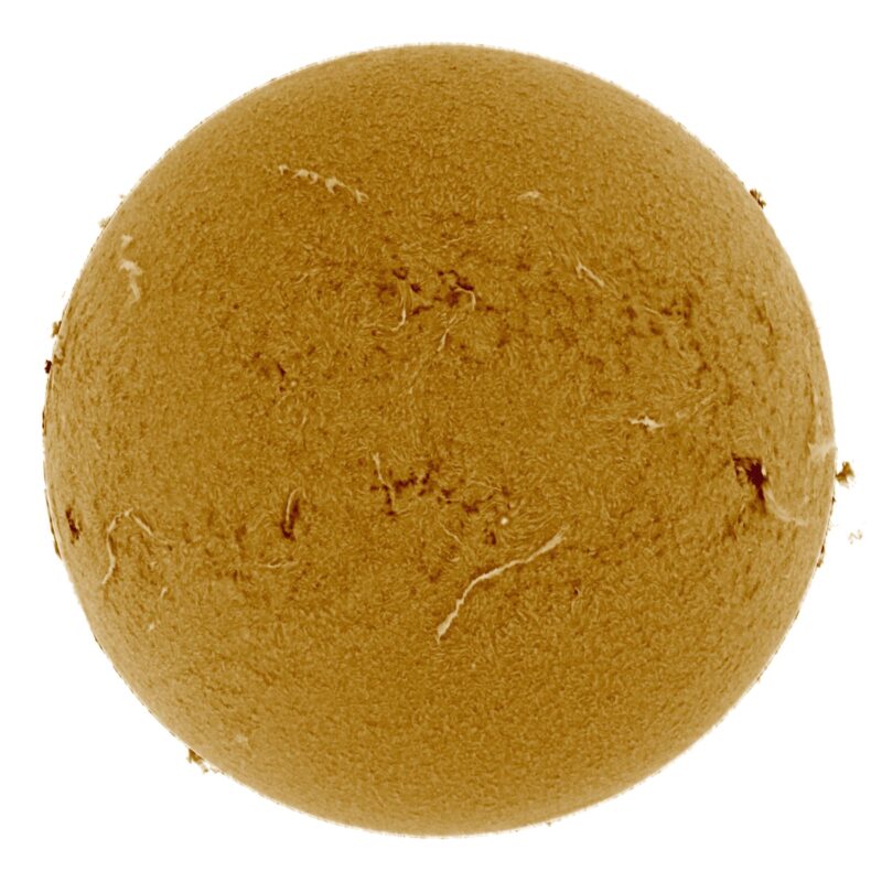 The sun, seen as a large yellow sphere with a mottled surface.