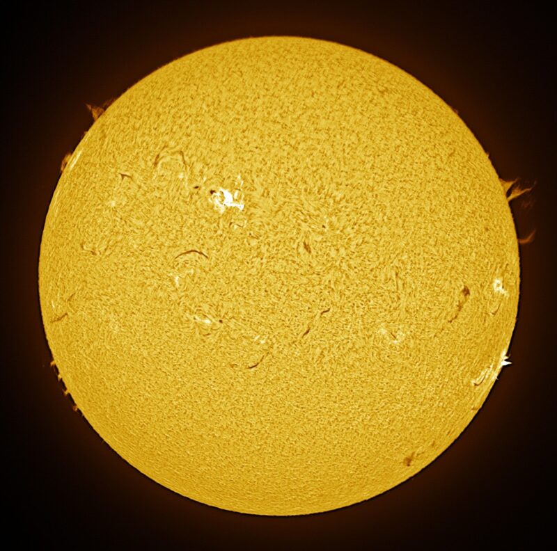 The sun, seen as a large yellow sphere with a mottled surface.