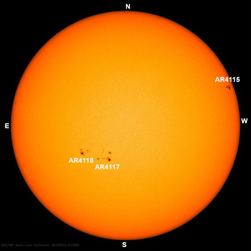 The sun, seen as a large yellow sphere with dark spots, each labeled.