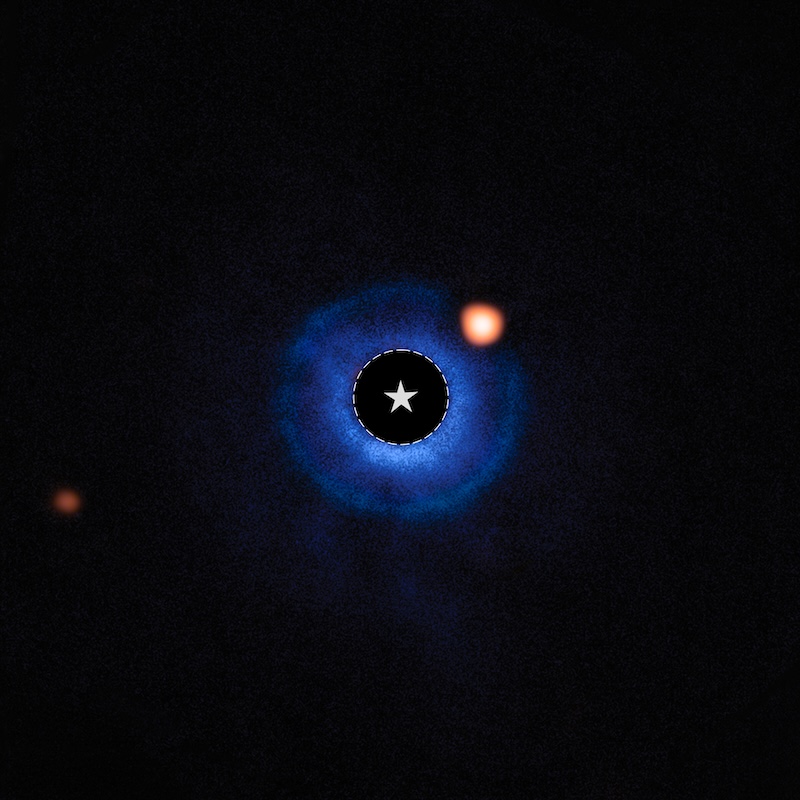 Exoplanet: Blue donut-like ring on black background, with an orange dot in the ring, and a faint orange dot outside the ring.