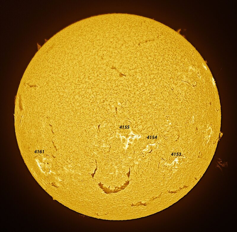 The sun, seen as a large yellow sphere with a mottled surface.