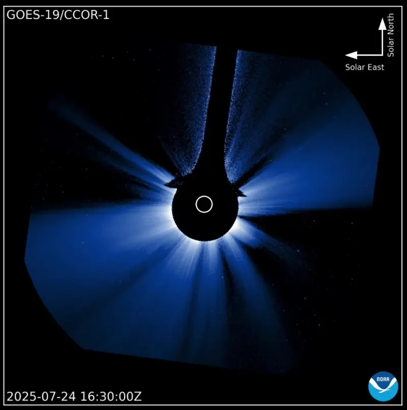 Animation of the sun's corona erupting on one side, while the moon crosses from right to left.