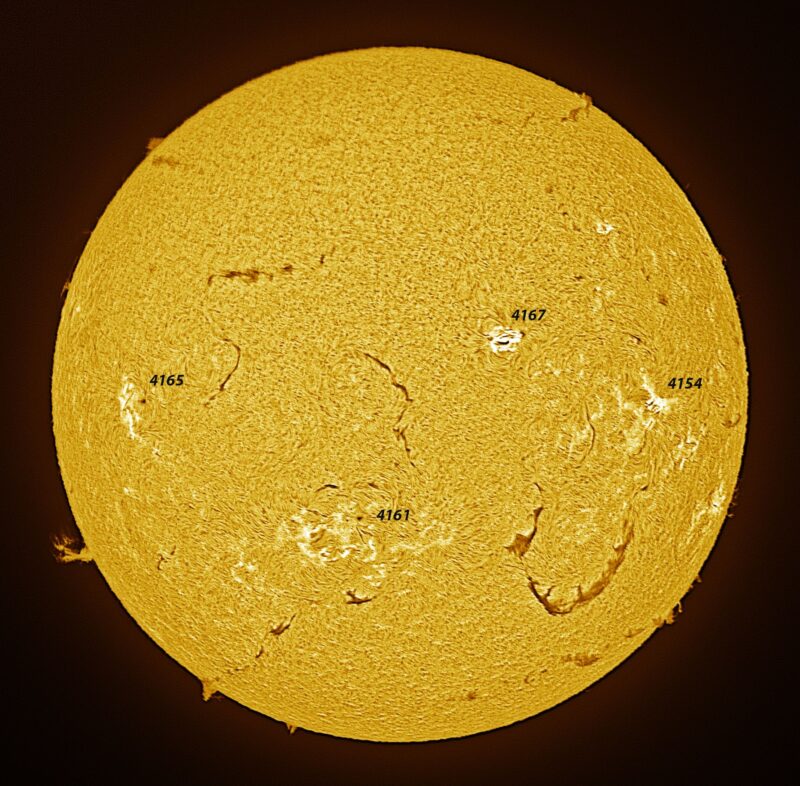 The sun, seen as a large yellow sphere with a mottled surface.