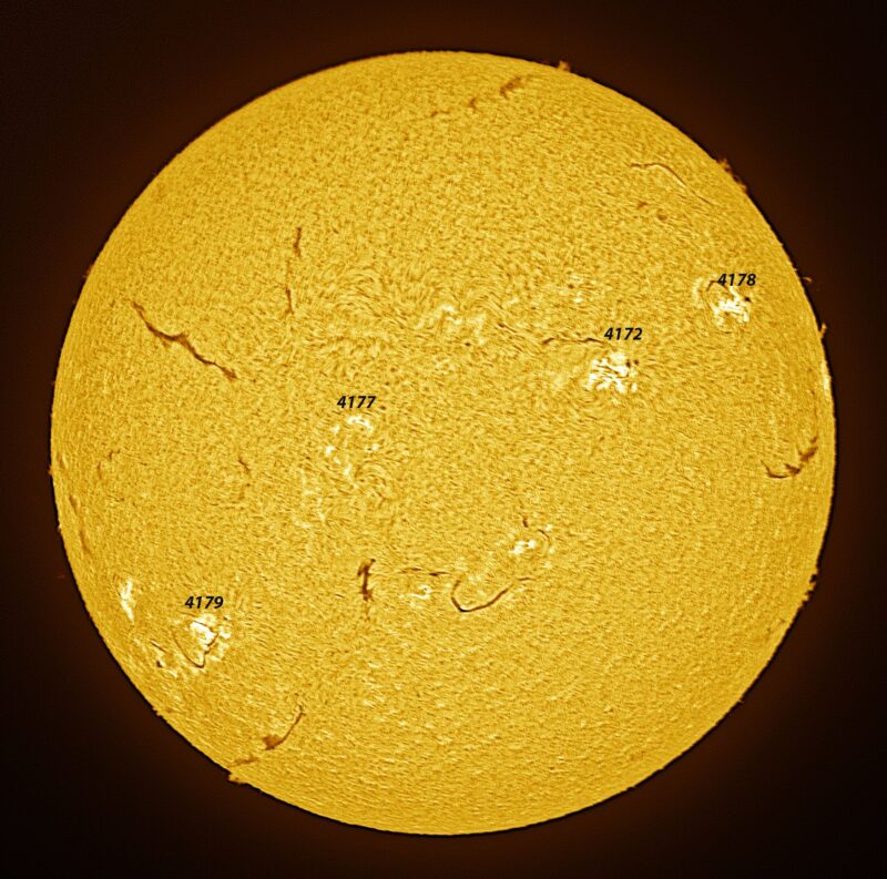The sun, seen as a large yellow sphere with a mottled surface.