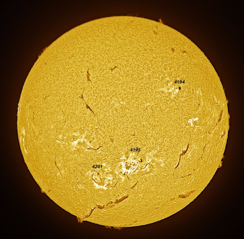 The sun, seen as a large yellow sphere with a mottled surface.