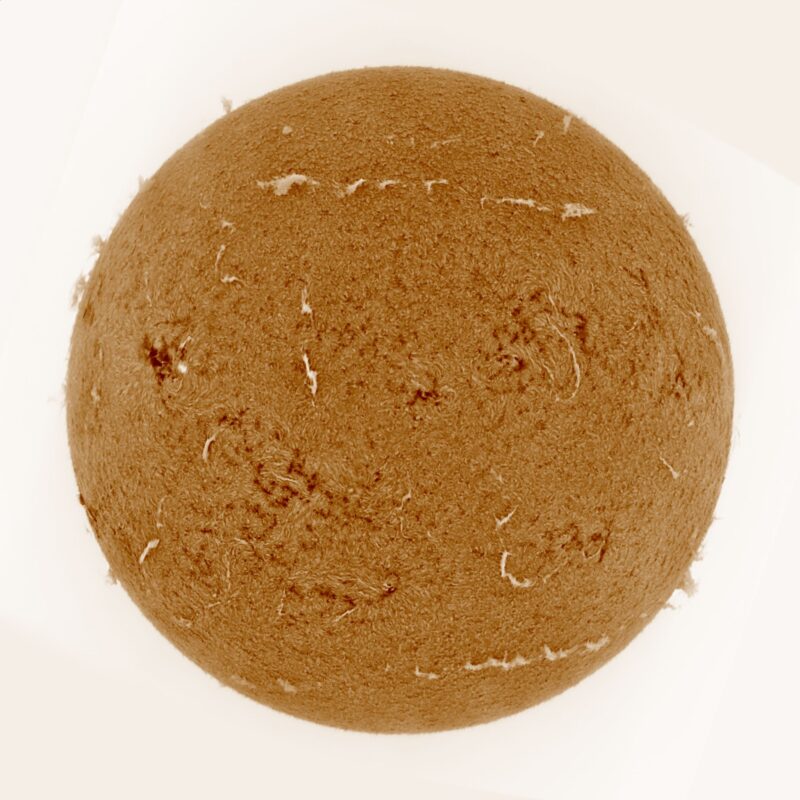 The sun, seen as a large yellow sphere with a mottled surface.