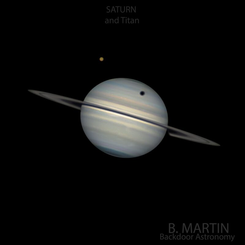 Planet with bands on its surface and rings around it. There is a little objet to the top left, casting a shadow on the planet.