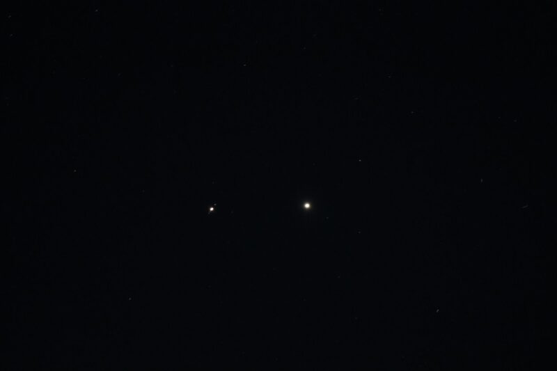 Two bright dots. The one on the right is a bit bigger and brighter. The one on the left has 3 small dots in a line.