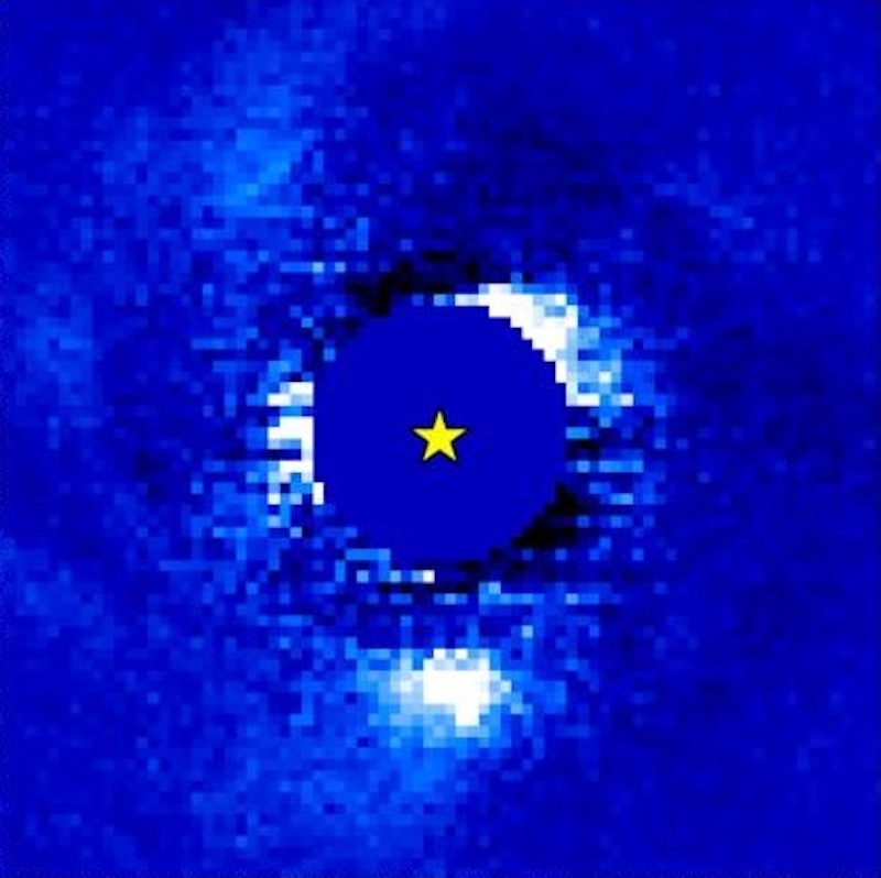 Growth of baby planet: Blue solid circle with yellow star in the center. Pixelated white patches are around the edge of the circle.