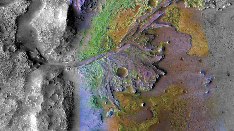 Jezero crater: View from above of terrain with a meandering river delta and small craters in grays, blues and greens.