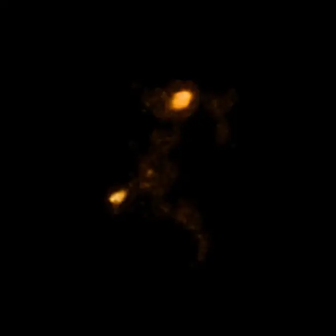 Animated image showing 2 orange nebulous blobs with faint orange nebulosity between them.
