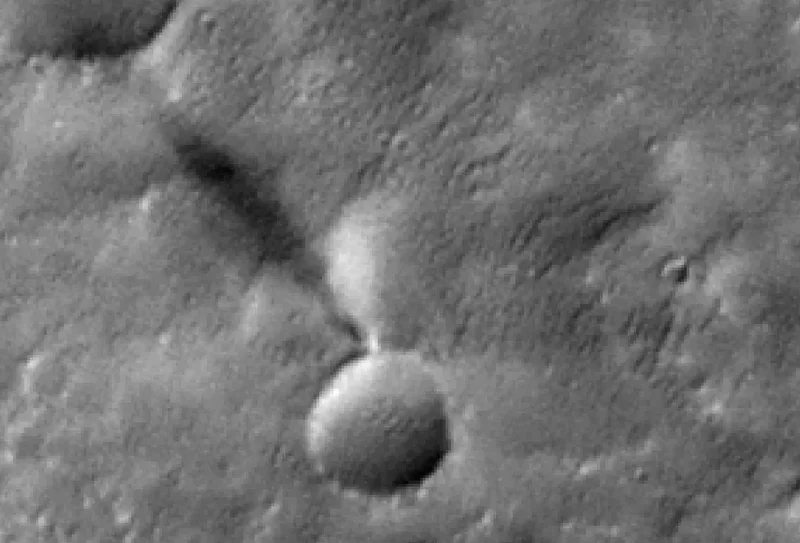 Animation of a tornado-like dust devil moving near a large crater as viewed from above.