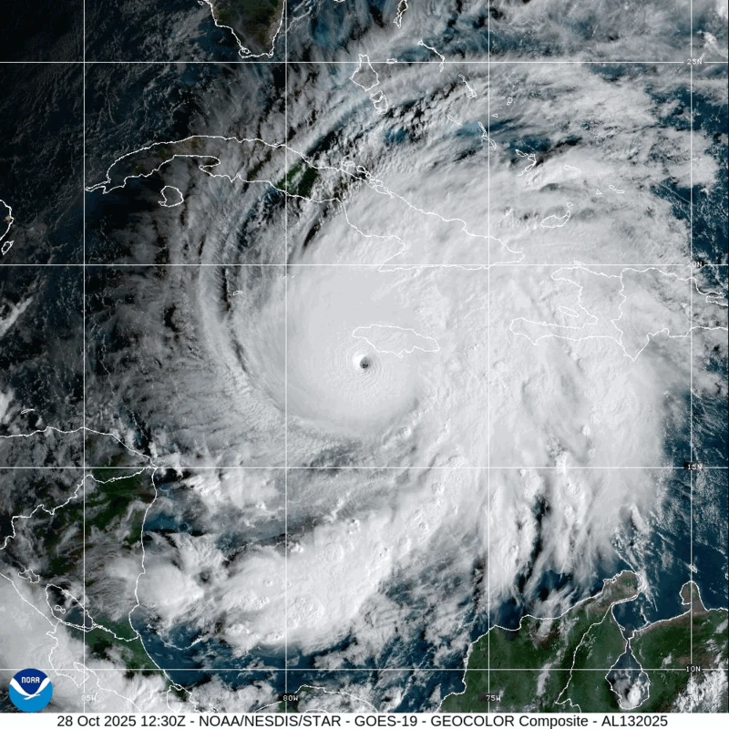 Satellite image of dense clouds spinning over the Caribbean. With the eye reaching Jamaica.