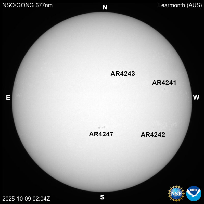 The sun, seen as a large white sphere with dark spots, each labeled.