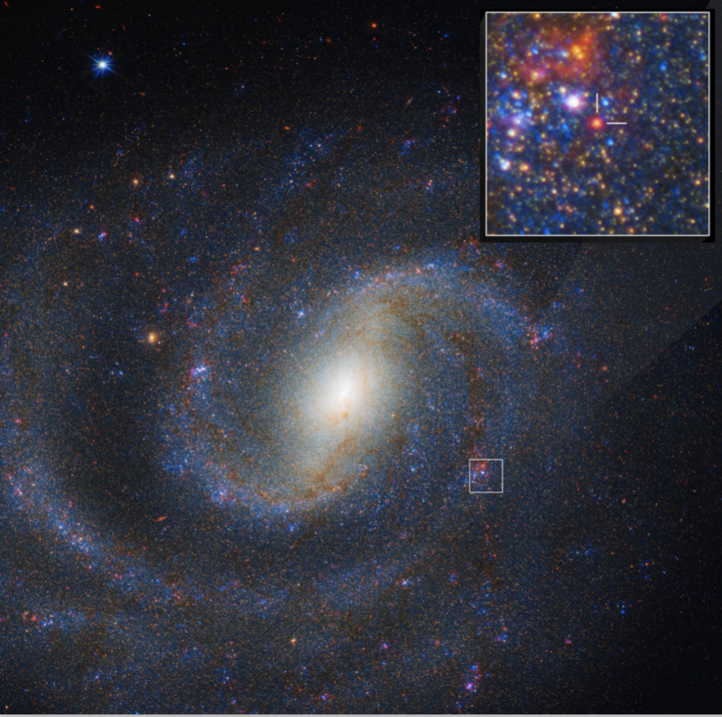 Doomed star: A spiral galaxy, with an inset dense with stars and tick marks around the red star that exploded.