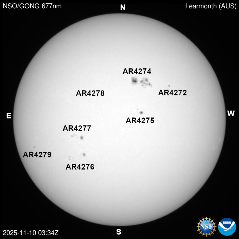 The sun, seen as a large white sphere with dark spots, each labeled.